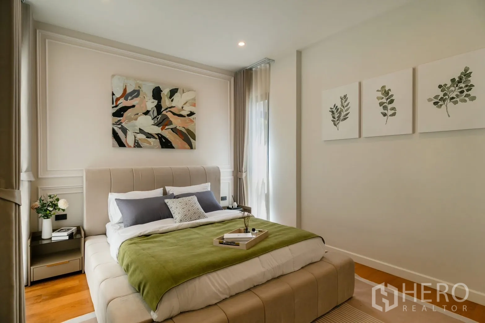 Detached House for rent or sale in Saphan Sung, Bangkok - Guest bedroom with upholstered bed and green throw blanket.