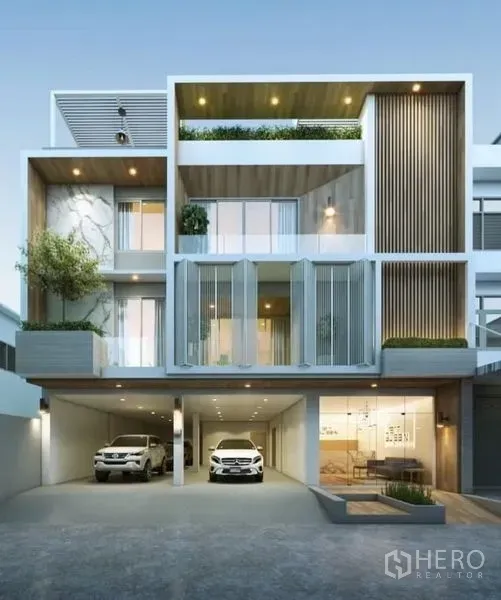 带办公室的家 出租或出售在Suan Luang, Bangkok - 现代多层住办合一外立面，带车库与阳台。