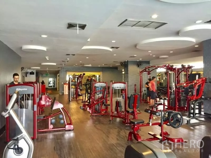Condominium for rent in Khlong Toei, Bangkok - Another view of the condo gym showing strength machines and treadmills.
