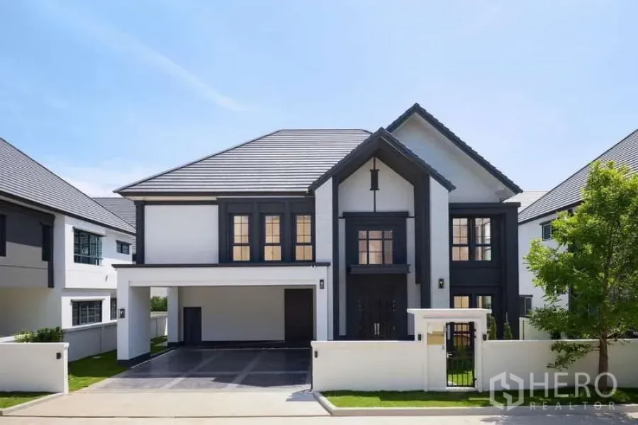 Detached House for rent or sale in Bang Phli, Samut Prakan - Modern two-storey detached house exterior with gabled roof, carport and gated front yard in Bang Phli.