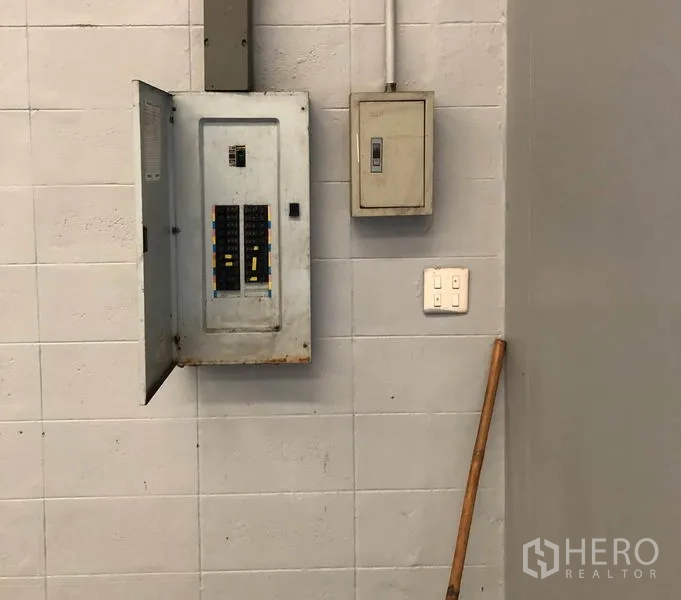 Factory for rent in Pathum Thani - Electrical control panel and breaker box mounted on the factory wall.