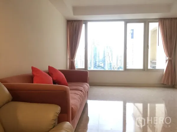 Condominium for rent in Watthana, Bangkok - Spacious living room with pink sofa, large windows, tiled floor and skyline outlook.