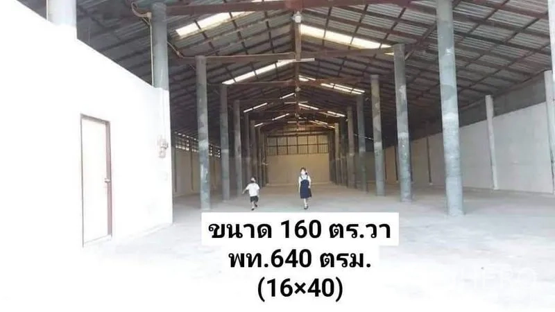 Warehouse for rent in Nakhon Pathom - Spacious warehouse interior with high gabled steel roof, concrete floor and clear-span layout.