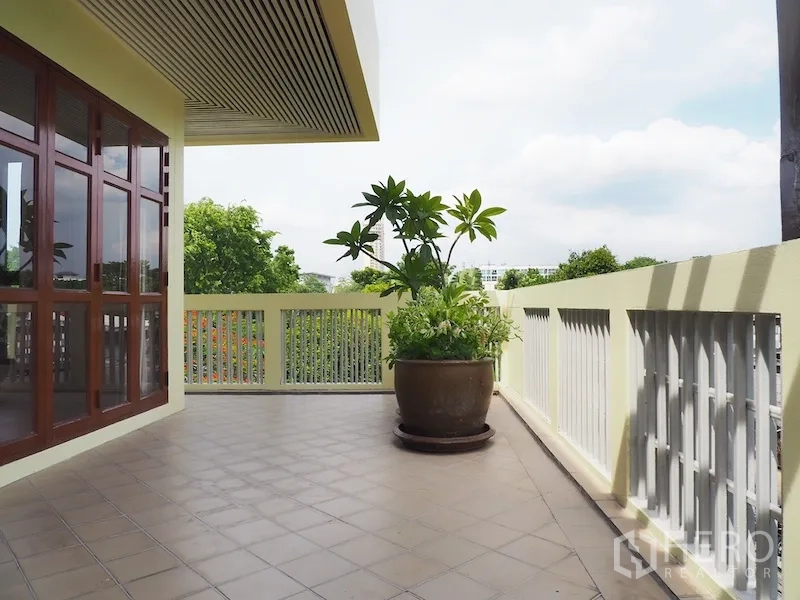 Detached House for rent in Chatuchak, Bangkok - Large upper terrace with planters, tiled floor, and open neighborhood views.