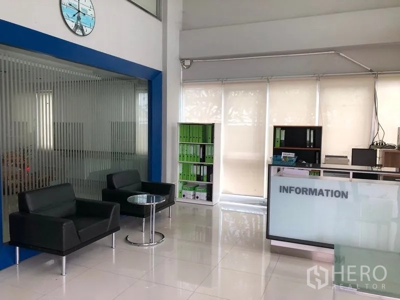Factory for rent or sale in Lat Lum Kaeo, Pathum Thani - Reception area with information desk, shelving and natural light.