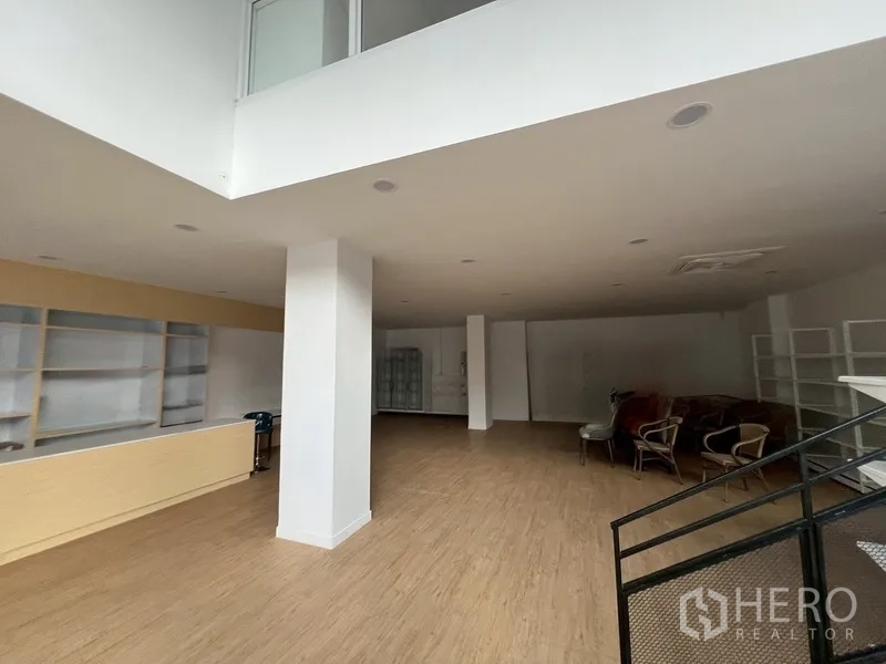 Retail Space for rent in Watthana, Bangkok - Large open sales floor with shelving, seating and high ceilings.