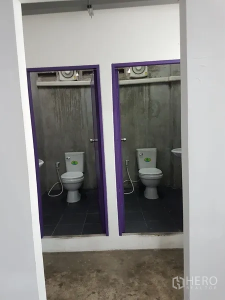 Home Office for sale in Khlong Toei, Bangkok - Reception zone with purple wall adjoining glass meeting rooms.