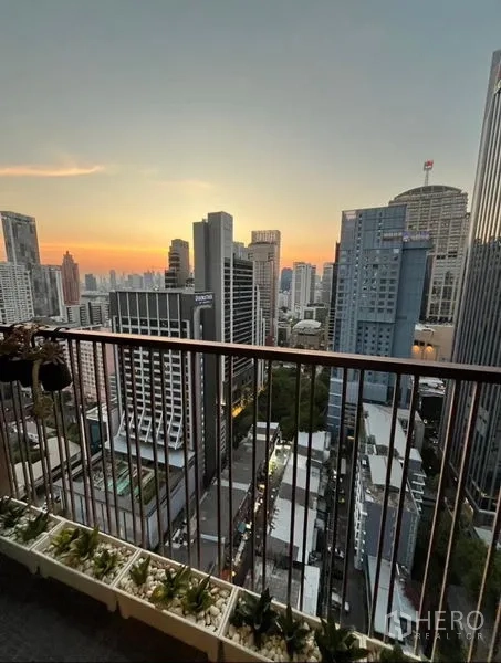 Condominium for rent in Bangkok - High-floor balcony at sunset with wide Bangkok skyline near Phrom Phong BTS.