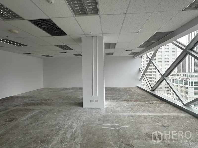 Office Space for rent in Watthana, Bangkok - Corner of the office with full-length windows and a skyline outlook.