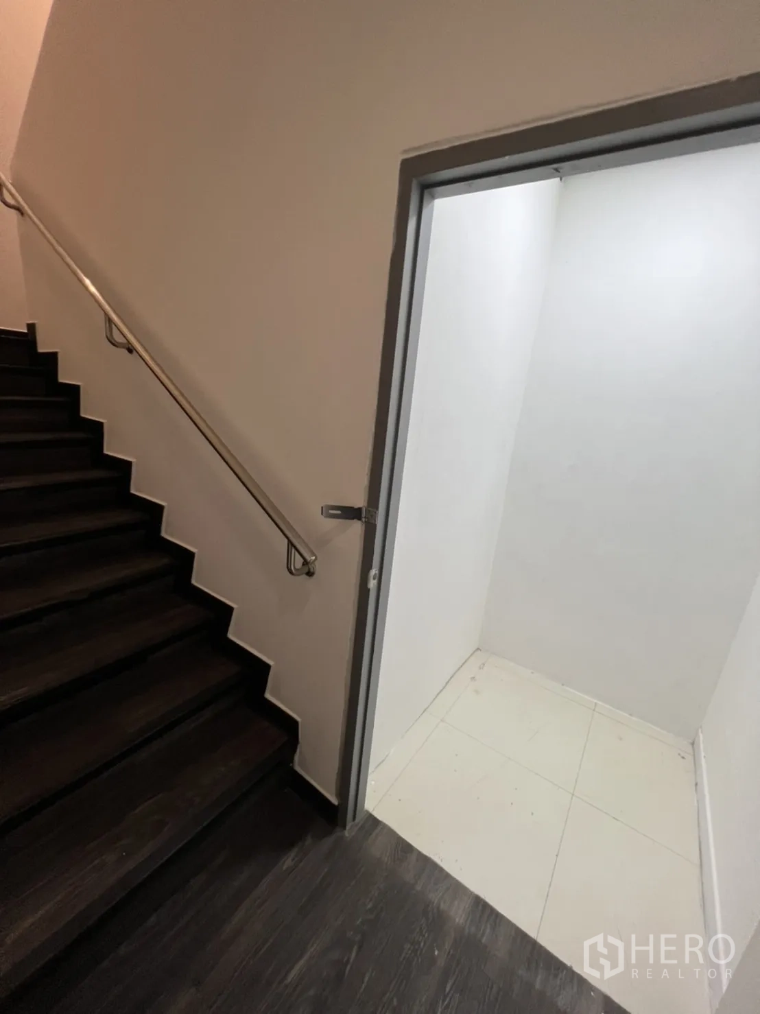 Retail Space for rent in Sathon, Bangkok - Stairwell with stainless handrail and a small storage room beside it.