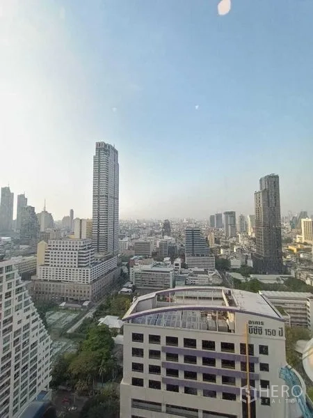 Condominium for rent or sale in Bang Rak, Bangkok - High-rise Bangkok skyline view from the condominium window.