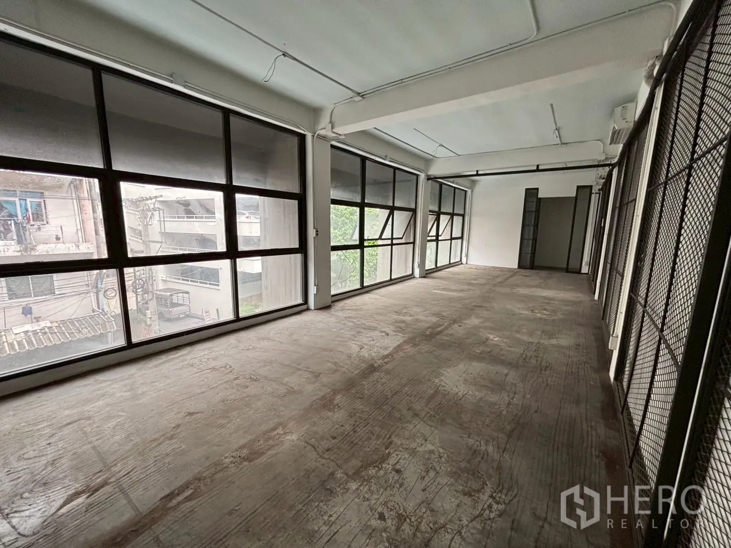 Retail Space for rent - Long rectangular retail floor with full-height glazing providing strong natural light and street visibility.