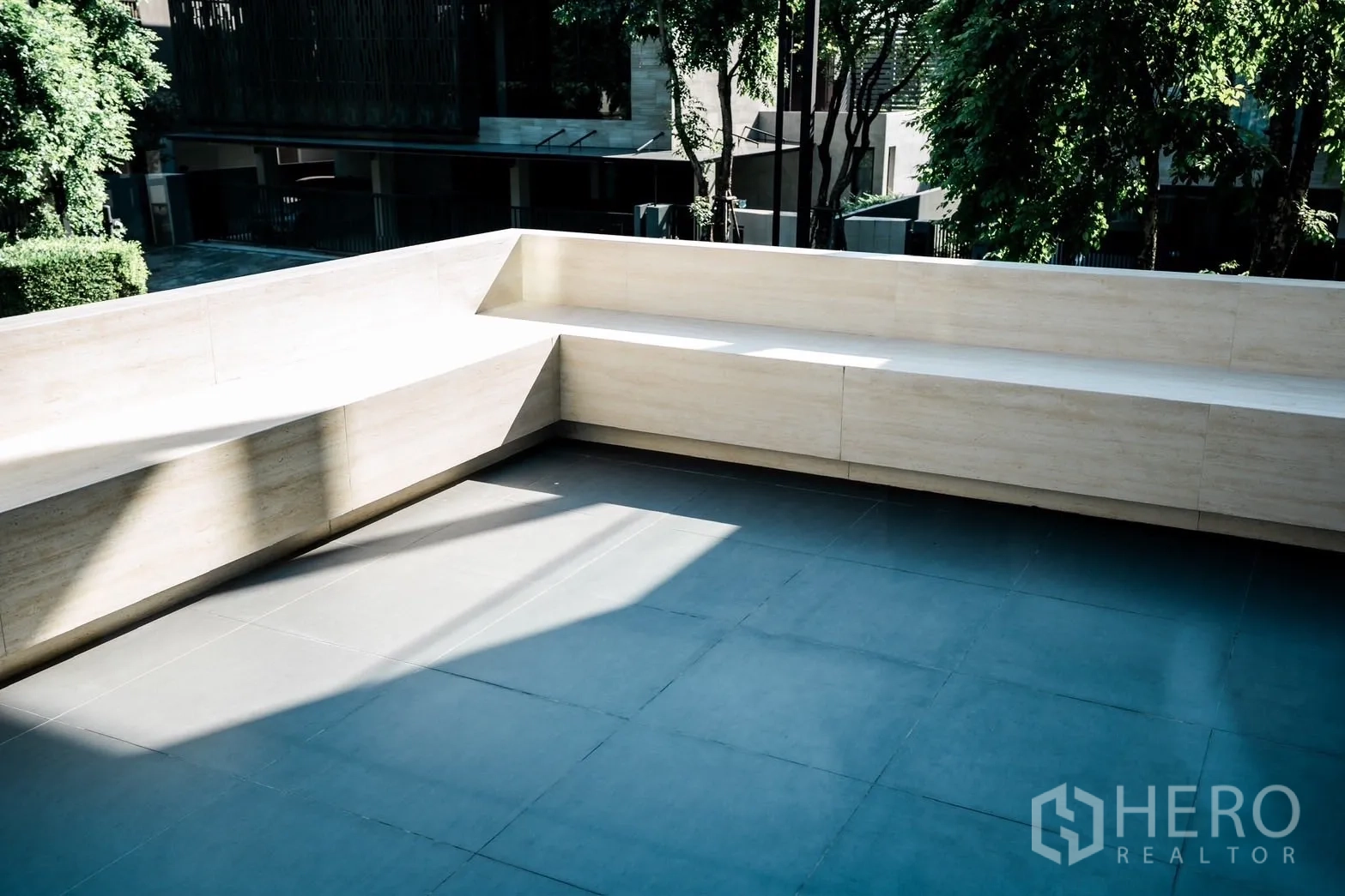 Detached House for rent or sale in Bang Kapi, Bangkok - Large terrace with built‑in bench seating and views of mature trees.