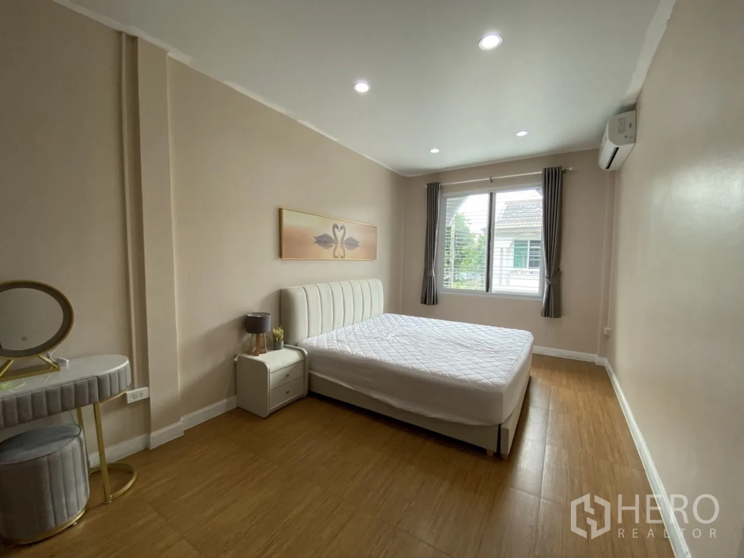 Townhouse for rent or sale - Master bedroom view showing window, curtains, air-conditioning and natural light.