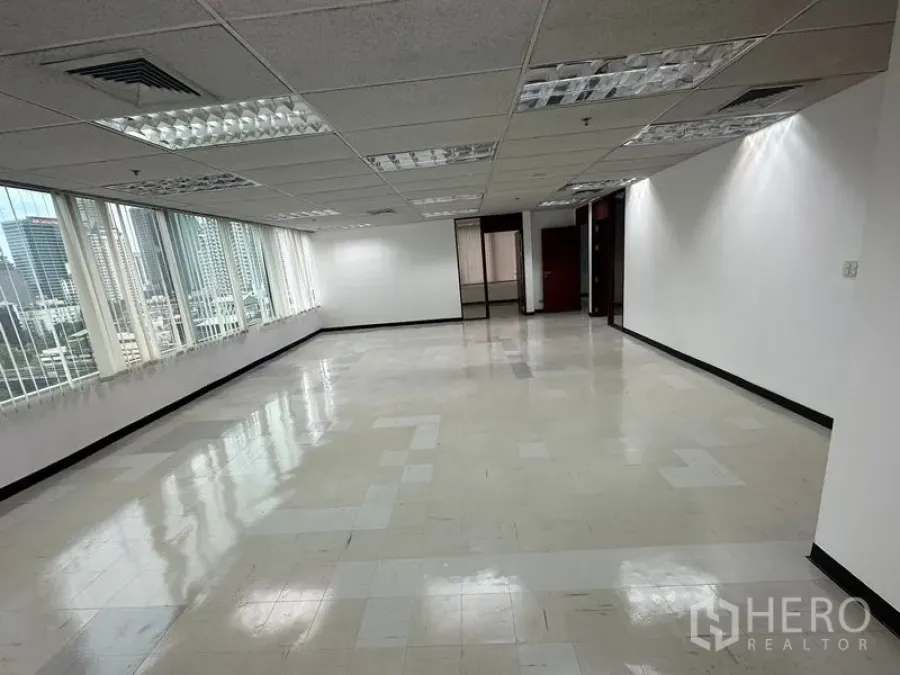 Office Space for rent in Chatuchak, Bangkok - Long open-plan workspace with large windows and Bangkok skyline views.