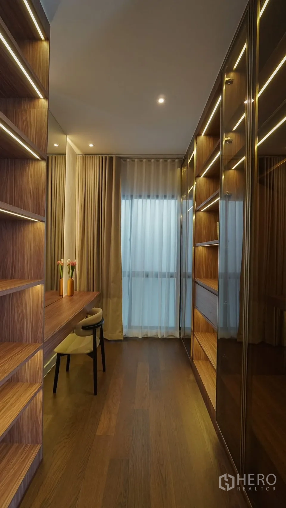Detached House for rent or sale in Bang Kapi, Bangkok - Bright dressing room with built-in shelves, marble-top vanity and sheer curtains.