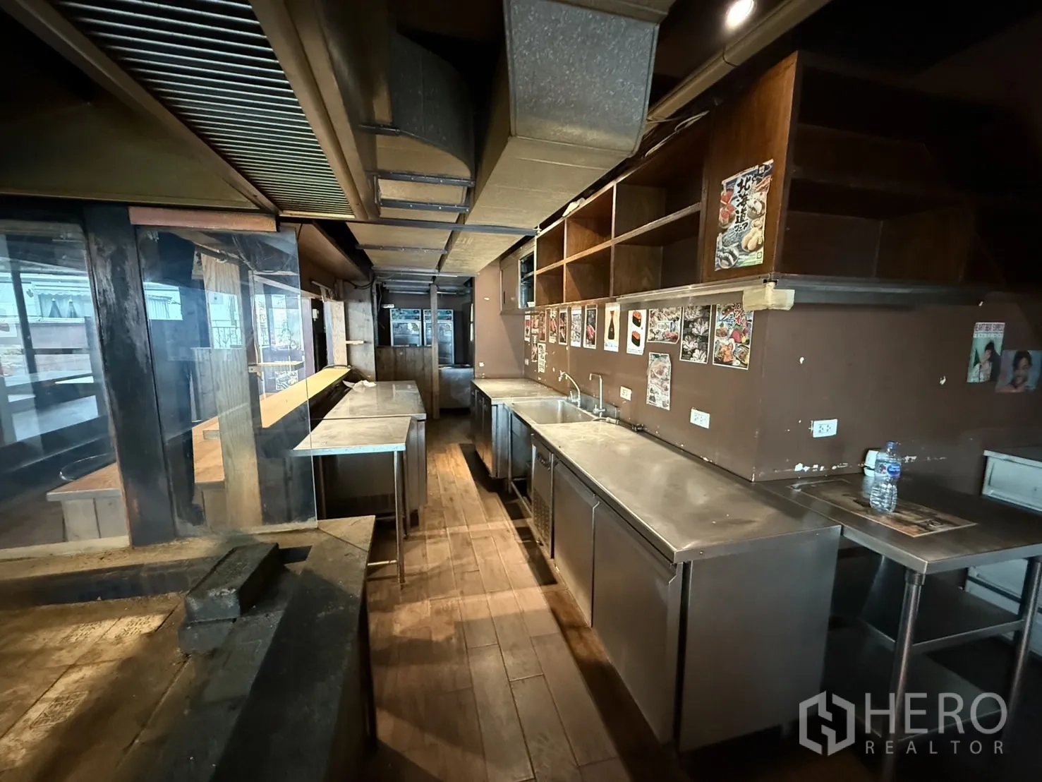 Detached House for rent in Watthana, Bangkok - Long stainless prep area with shelving and extractor ducts behind the bar.