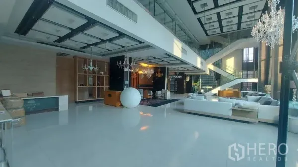 Retail Space for rent in Watthana, Bangkok - Spacious showroom lounge with mezzanine level and sculptural staircase