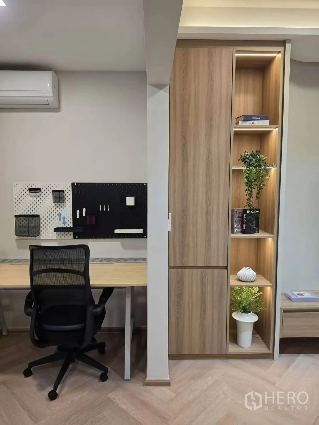 Townhouse for rent in Bang Phli, Samut Prakan - Built-in workstation with pegboards, task chair, and illuminated shelving.