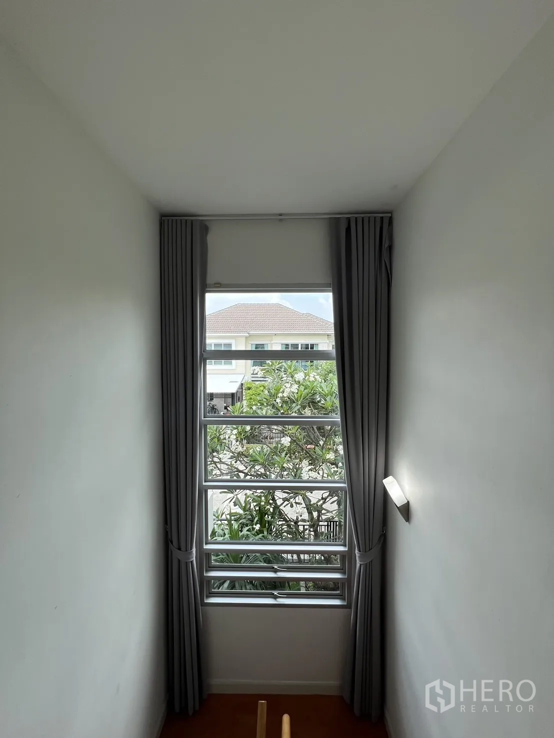 Detached House for rent in Saphan Sung, Bangkok - Master bedroom with bed, balcony doors and air conditioner.