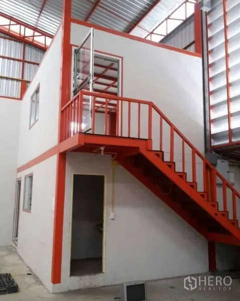 Warehouse for rent in Bang Phli, Samut Prakan - Close-up of internal two-storey office with orange stair and glass door