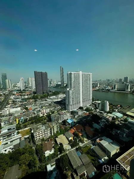 คอนโด ให้เช่าหรือขาย - วิวมุมสูงของเส้นขอบฟ้าและแม่น้ำเจ้าพระยาจากตัวคอนโด