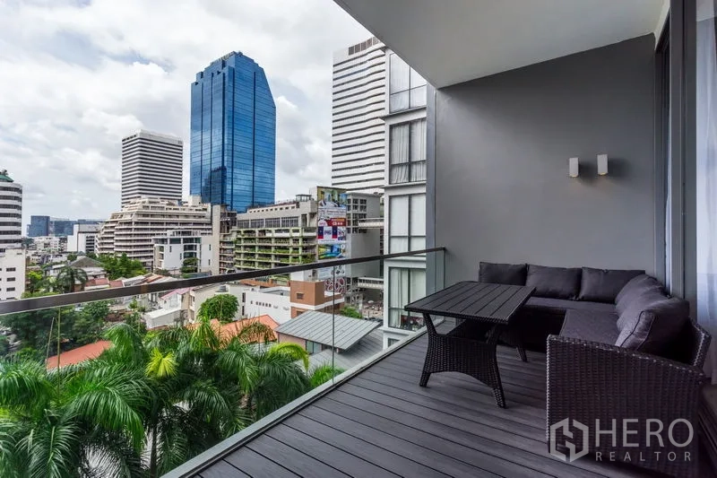 Condominium for rent in Khlong Toei, Bangkok - Private balcony with outdoor sofa and city skyline views near Asok.
