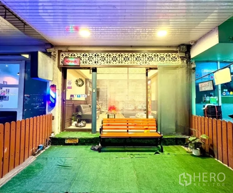 Shophouse for rent in Watthana, Bangkok - Front terrace with orange bench and sliding glass doors into the shop.