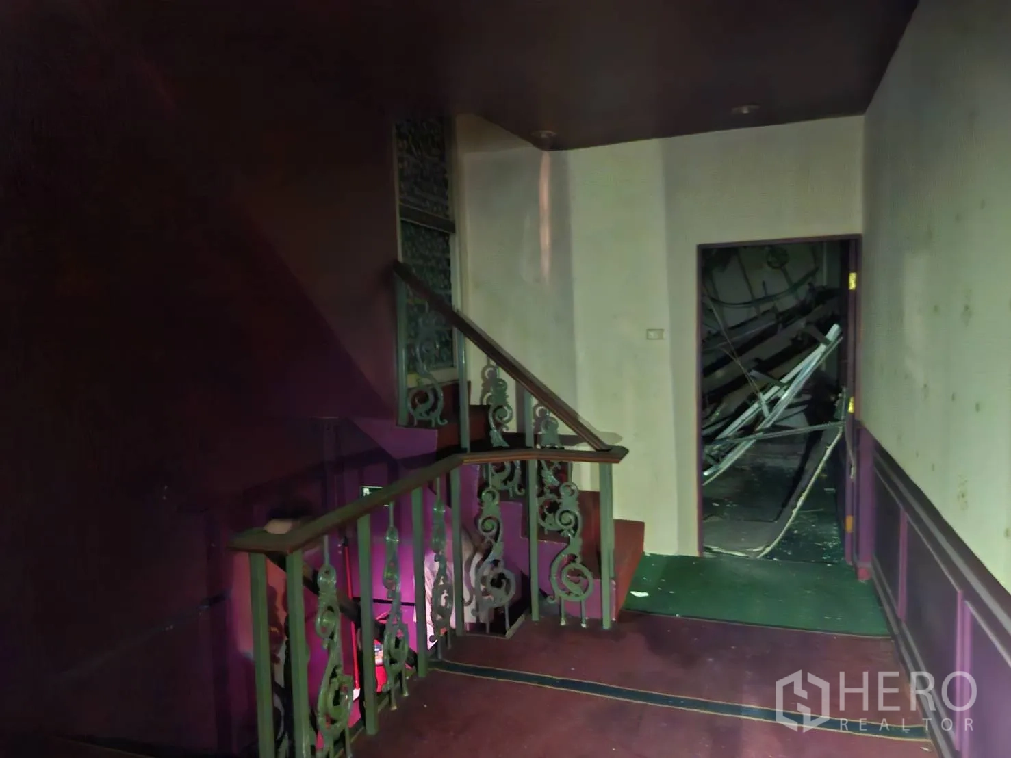 Shophouse for rent in Bang Rak, Bangkok - Upper-level corridor with staircase and doorway leading to storage or back rooms.