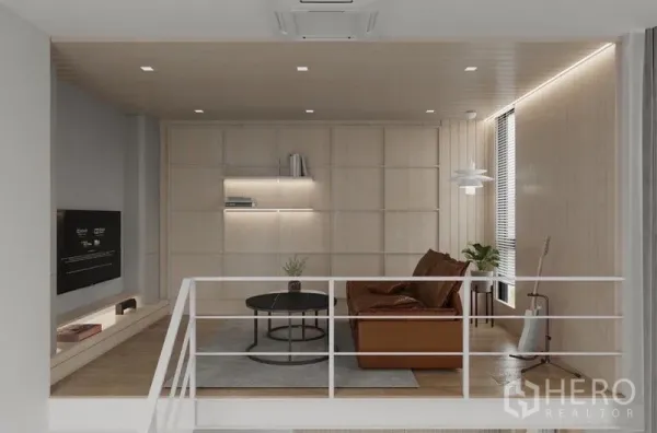 Detached House for rent in Saphan Sung, Bangkok - Mezzanine family lounge with leather sofa, light‑wood paneling and built‑in shelves.