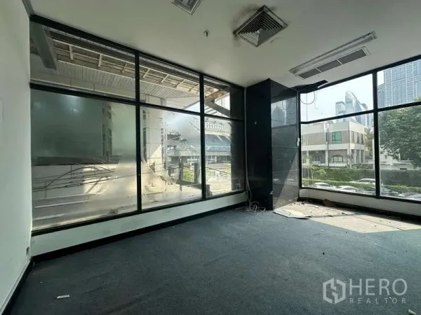 Retail Space for rent - Vacant 27 sqm corner retail unit with floor-to-ceiling windows offering city views and strong natural light.