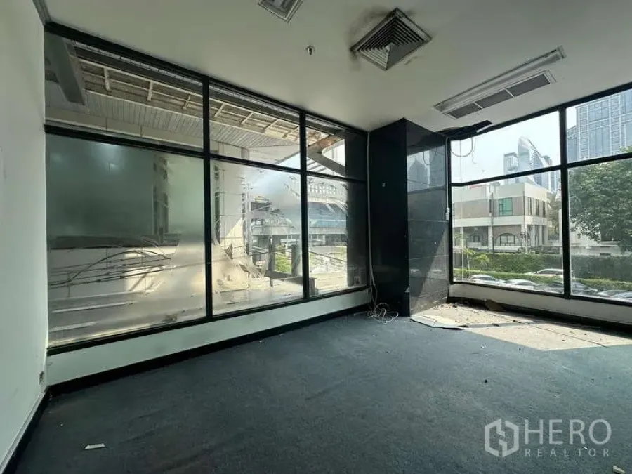 Retail Space for rent - Vacant 27 sqm corner retail unit with floor-to-ceiling windows offering city views and strong natural light.