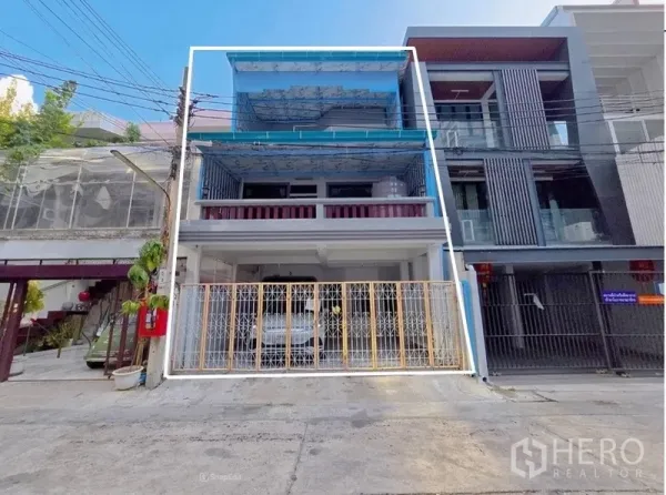 Home Office for rent in Sathon, Bangkok - Front exterior of a three-storey home office in Sathon with blue awnings, balconies and a gated entrance.