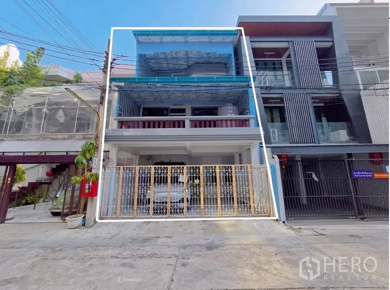 Home Office for rent in Sathon, Bangkok - Front exterior of a three-storey home office in Sathon with blue awnings, balconies and a gated entrance.