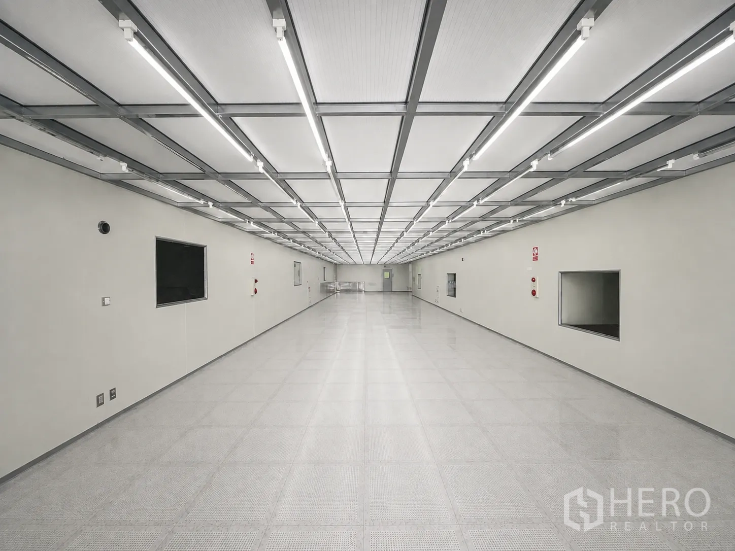 Factory for rent or sale in Wang Noi, Phra Nakhon Si Ayutthaya - Cleanroom-style corridor with bright linear lighting and smooth wall panels.