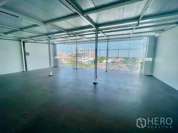 Home Office for rent or sale in Bang Kapi, Bangkok - Open office level with mesh screen wall, city views, and abundant natural light.