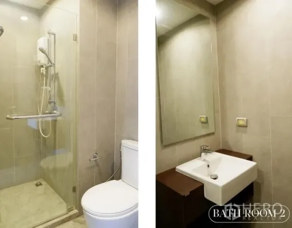 คอนโด ให้เช่าในWatthana, Bangkok - ห้องน้ำสมัยใหม่ มีกระจกกั้นอาบน้ำ โถสุขภัณฑ์ และอ่างล้างหน้าพร้อมกระจก