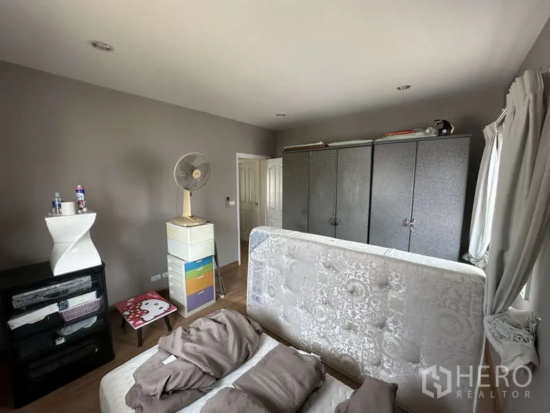 Detached House for sale in Sai Mai, Bangkok - Bedroom angle showing wardrobes and natural light.