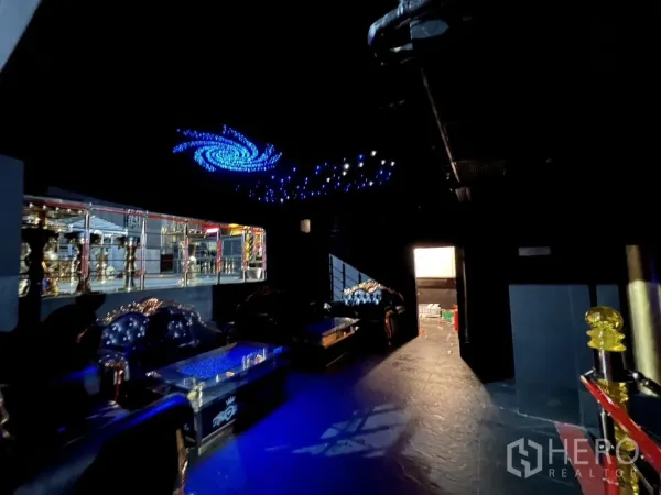Retail Space for rent - Lounge zone with blue LED galaxy ceiling lights and leather sofas.