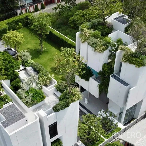 Detached House for sale in Saphan Sung, Bangkok - Aerial view of modern white detached house with lush rooftop gardens in Saphan Sung, Bangkok.
