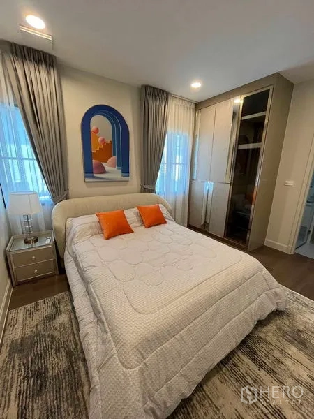 Detached House for rent in Saphan Sung, Bangkok - Modern detached house facade with gated driveway, landscaped yard and white exterior.