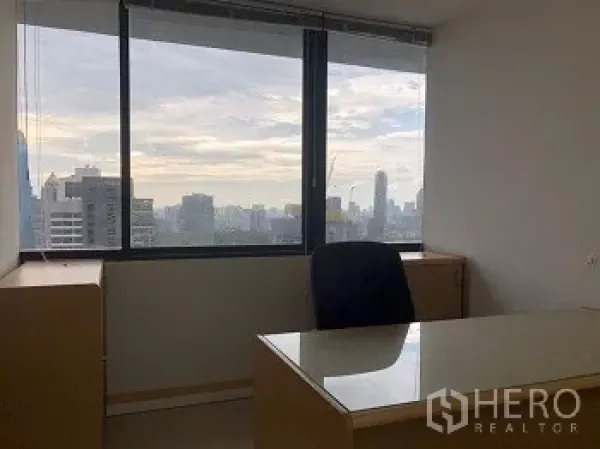 Office Space for rent or sale in Bang Rak, Bangkok - Private office desk by a large window with panoramic Bangkok city views.