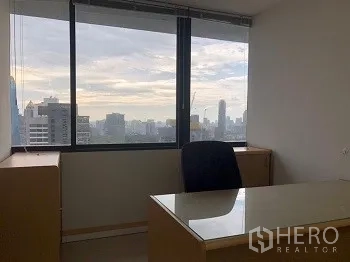 Office Space for rent or sale in Bang Rak, Bangkok - Private office desk by a large window with panoramic Bangkok city views.