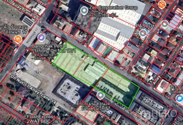 Land for sale - Satellite map highlighting a large rectangular land plot outlined in green in Suan Luang, Bangkok, near the On Nut BTS area with surrounding roads and buildings.