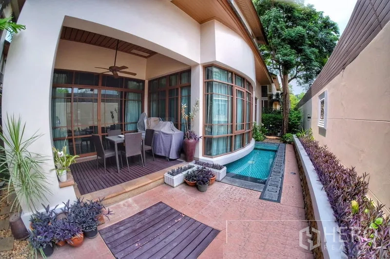 Detached House for rent in Watthana, Bangkok - Covered terrace with ceiling fan beside a private plunge pool and landscaped border.