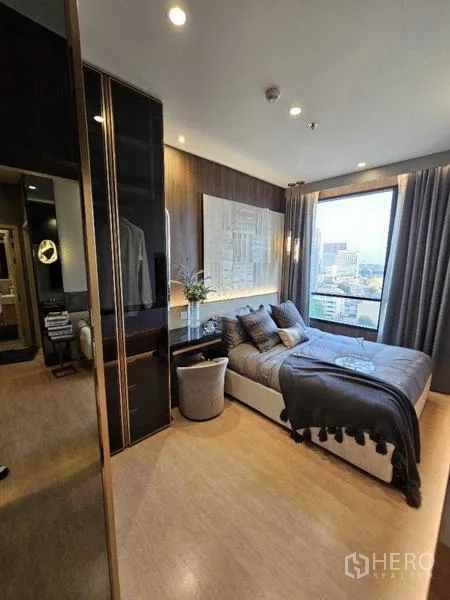 Condominium for rent - Master bedroom with city view window, workstation and fitted wardrobe.