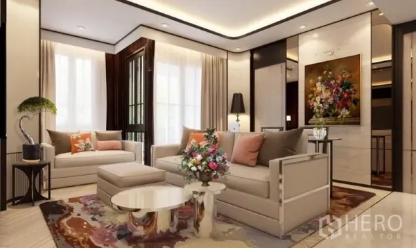Condominium for rent in Watthana, Bangkok - Bright lounge with twin sofas, floral rug, round coffee table, accent artwork, and a glass door toward the balcony.