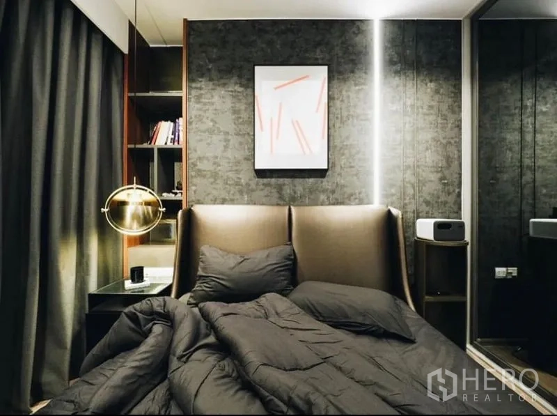 Condominium for rent - Master bedroom with textured dark feature wall and gold pendant lamp.