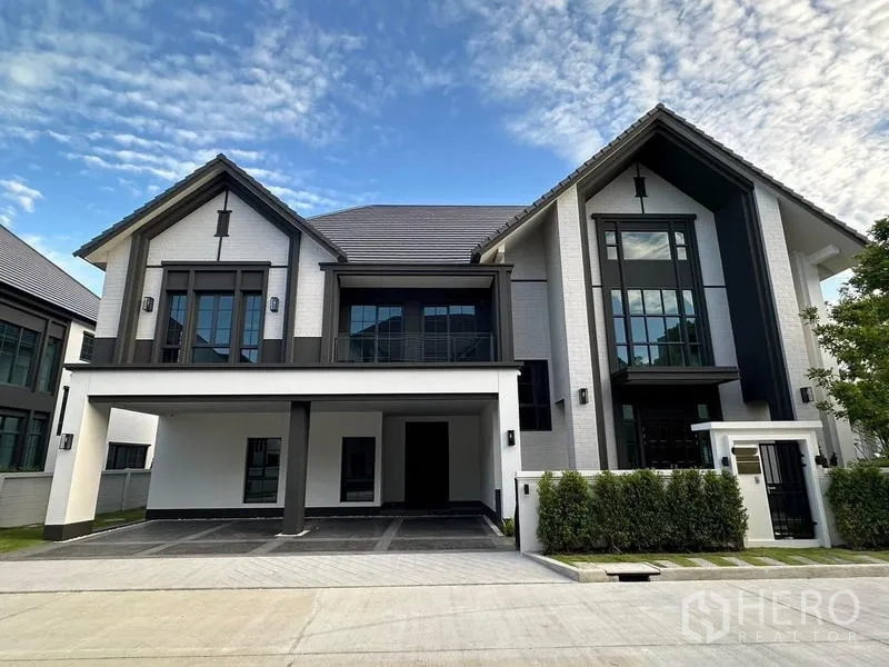 Detached House for rent or sale in Bang Phli, Samut Prakan - Front elevation of the modern detached house with clean lines and steep gable roofs.
