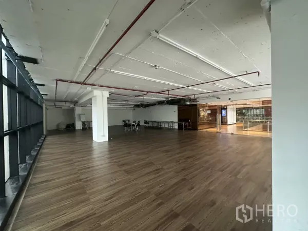 Retail Space for rent - Spacious unit facing glass doors, industrial ceiling and abundant natural light.